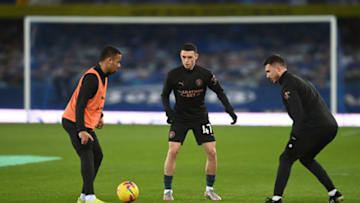 LIVERPOOL, ENGLAND - FEBRUARY 17: Gabriel Jesus, Phil Foden and Aymeric Laporte of Manchester City warm up prior to the Premier League match between Everton and Manchester City at Goodison Park on February 17, 2021 in Liverpool, England. Sporting stadiums around the UK remain under strict restrictions due to the Coronavirus Pandemic as Government social distancing laws prohibit fans inside venues resulting in games being played behind closed doors. (Photo by Michael Regan/Getty Images)