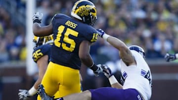 Oct 10, 2015; Ann Arbor, MI, USA; Michigan Wolverines linebacker James Ross (15) hits Northwestern Wildcats fullback Dan Vitale (40) in the third quarter at Michigan Stadium. Michigan won 38-0. Mandatory Credit: Rick Osentoski-USA TODAY Sports