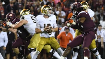 BLACKSBURG, VA - OCTOBER 6: Quarterback Ian Book #12 of the Notre Dame Fighting Irish looks to pass against the Virginia Tech Hokies in the second half at Lane Stadium on October 6, 2018 in Blacksburg, Virginia. (Photo by Michael Shroyer/Getty Images)