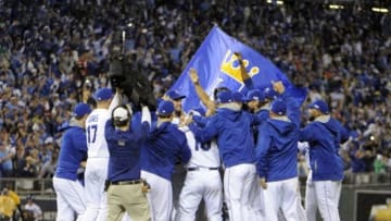 Oct 5, 2014; Kansas City, MO, USA; Kansas City Royals players celebrate after defeating the Los Angeles Angels in game three of the 2014 ALDS baseball playoff game at Kauffman Stadium. The Royals won 8-3 advancing to the ALCS against the Baltimore Orioles. Mandatory Credit: John Rieger-USA TODAY Sports