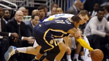 Jan 6, 2016; Orlando, FL, USA; Orlando Magic guard Mario Hezonja (23) and Indiana Pacers guard Monta Ellis (11) go after a loose ball during the second half at Amway Center. Indiana defeated Orlando 95-86. Mandatory Credit: Kim Klement-USA TODAY Sports