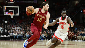 Mar 26, 2023; Cleveland, Ohio, USA; Cleveland Cavaliers forward Cedi Osman (16) drives to the basket against Houston Rockets forward Usman Garuba (16) during the second half at Rocket Mortgage FieldHouse. Mandatory Credit: Ken Blaze-USA TODAY Sports