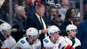 LOS ANGELES, CA - OCTOBER 19: Head coach Bill Peters of the Calgary Flames looks on from the bench during the first period of the game against the Los Angeles Kings at STAPLES Center on October 19, 2019 in Los Angeles, California. (Photo by Adam Pantozzi/NHLI via Getty Images)