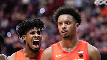 TALLAHASSEE, FL - FEBRUARY 15: Quincy Guerrier #1 cheers on his teammate Elijah Hughes #33 of the Syracuse Orange after scoring a basket against the Florida State Seminoles during the game at the Donald L. Tucker Center on February 15, 2020 in Tallahassee, Florida. Florida State defeated Syracuse 80 to 77. (Photo by Don Juan Moore/Getty Images)