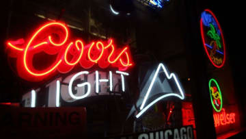 CHICAGO - OCTOBER 9: A Coors beer sign hangs in a bar October 9, 2007 in Chicago, Illinois. Molson Coors and SABMiller said they will combine their North American operations to challenge the dominance of Anheuser-Busch which holds a nearly 50 percent market share. SABMiller the number 2 U.S. beer seller has about a 20 percent market share and Molson Coors is number 3 with just over 10 percent market share. (Photo by Scott Olson/Getty Images)