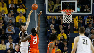 ANN ARBOR, MI - JANUARY 25: Michigan Wolverines forward Austin Davis (51) shoots over Illinois Fighting Illini center Kofi Cockburn (21) during a regular season Big Ten Conference game between the Illinois Fighting Illini (21) and the Michigan Wolverines on January 25, 2020, at Crisler Center in Ann Arbor, Michigan. Illinois defeated Michigan 64-62. (Photo by Scott W. Grau/Icon Sportswire via Getty Images)