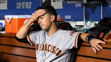LOS ANGELES, CA - JUNE 19: Buster Posey #28 of the San Francisco Giants sits in the dugout in the fifth inning of the game against the Los Angeles Dodgers at Dodger Stadium on June 19, 2019 in Los Angeles, California. (Photo by Jayne Kamin-Oncea/Getty Images)