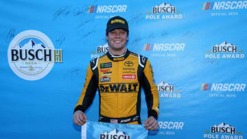LAS VEGAS, NV - SEPTEMBER 14: Erik Jones, driver of the #20 DeWalt Toyota, poses with the Busch Pole award after qualifying for the Monster Energy NASCAR Series South Point Hotel and Casino 400 at Las Vegas Motor Speedway on September 14, 2018 in Las Vegas, Nevada. (Photo by Matt Sullivan/Getty Images)