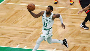 BOSTON, MA - NOVEMBER 16: Kyrie Irving #11 of the Boston Celtics drives to the basket during the first half against the Toronto Raptors at TD Garden on November 16, 2018 in Boston, Massachusetts. (Photo by Tim Bradbury/Getty Images)
