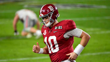 MIAMI GARDENS, FLORIDA - JANUARY 11: Mac Jones #10 of the Alabama Crimson Tide runs off the field during the College Football Playoff National Championship football game against the Ohio State Buckeyes at Hard Rock Stadium on January 11, 2021 in Miami Gardens, Florida. The Alabama Crimson Tide defeated the Ohio State Buckeyes 52-24. (Photo by Alika Jenner/Getty Images)