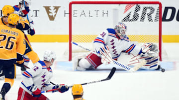 Oct 21, 2021; Nashville, Tennessee, USA; New York Rangers goaltender Igor Shesterkin (31) makes a save during the second period against the Nashville Predators at Bridgestone Arena. Mandatory Credit: Christopher Hanewinckel-USA TODAY Sports