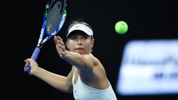 BEIJING, CHINA - OCTOBER 04: Maria Sharapova of Russia returns a shot against Simona Halep of Romania during the Women's singles 3rd round on day five of 2017 China Open at the China National Tennis Centre on October 4, 2017 in Beijing, China. (Photo by Lintao Zhang/Getty Images)