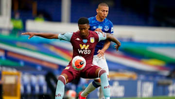 Aston Villa's English defender Ezri Konsa (front) vies with Everton's Brazilian striker Richarlison during the English Premier League football match between Everton and Aston Villa at Goodison Park in Liverpool, north west England on July 16, 2020. (Photo by Dave Thompson / POOL / AFP) / RESTRICTED TO EDITORIAL USE. No use with unauthorized audio, video, data, fixture lists, club/league logos or 'live' services. Online in-match use limited to 120 images. An additional 40 images may be used in extra time. No video emulation. Social media in-match use limited to 120 images. An additional 40 images may be used in extra time. No use in betting publications, games or single club/league/player publications. / (Photo by DAVE THOMPSON/POOL/AFP via Getty Images)