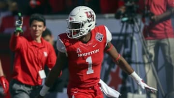 Dec 5, 2015; Houston, TX, USA; Houston Cougars quarterback Greg Ward Jr. (1) celebrates after scoring a touchdown during the first half against the Temple Owls in the Mid-American Conference football championship game at TDECU Stadium. Mandatory Credit: Troy Taormina-USA TODAY Sports