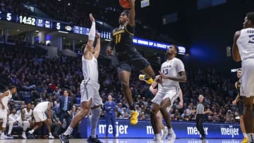 CINCINNATI, OH - NOVEMBER 12: Mario McKinney Jr. #11 of the Missouri Tigers shoots the ball against Paul Scruggs #1 of the Xavier Musketeers during the second half at Cintas Center on November 12, 2019 in Cincinnati, Ohio. (Photo by Michael Hickey/Getty Images)