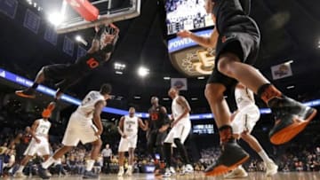 Feb 7, 2016; Atlanta, GA, USA; Miami (Fl) Hurricanes guard Sheldon McClellan (10) dunks over Georgia Tech Yellow Jackets guard Marcus Georges-Hunt (3) after an alley-oop pass from guard Angel Rodriguez (right) in the first half of their game at McCamish Pavilion. Mandatory Credit: Jason Getz-USA TODAY Sports
