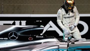 ABU DHABI, UNITED ARAB EMIRATES - NOVEMBER 25: Second place qualifier Lewis Hamilton of Great Britain and Mercedes GP climbs out of his car in parc ferme during qualifying for the Abu Dhabi Formula One Grand Prix at Yas Marina Circuit on November 25, 2017 in Abu Dhabi, United Arab Emirates. (Photo by Mark Thompson/Getty Images)