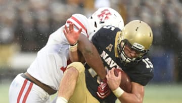 ANNAPOLIS, MD - OCTOBER 08: Ed Oliver #10 of Houston Cougars puts a hit on Will Worth #15 of the Navy Midshipmen in the second period during a football game at Navy-Marines Memorial Stadium on October 8, 2016 in Annapolis, Maryland. (Photo by Mitchell Layton/Getty Images)