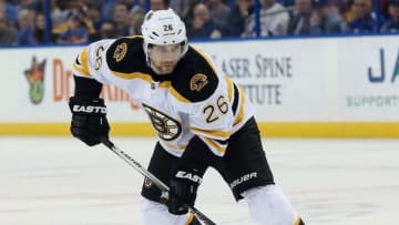 Mar 8, 2016; Tampa, FL, USA; Boston Bruins defenseman John-Michael Liles (26) skates with the puck against the Tampa Bay Lightning during the first period at Amalie Arena. Mandatory Credit: Kim Klement-USA TODAY Sports