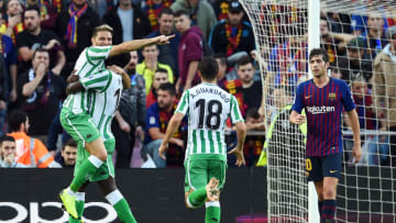 BARCELONA, SPAIN - NOVEMBER 11: Joaquin of Real Betis (L) celebrates with teammate William Carvalho of Real Betis after scoring his team's second goal during the La Liga match between FC Barcelona and Real Betis Balompie at Camp Nou on November 11, 2018 in Barcelona, Spain. (Photo by Alex Caparros/Getty Images)