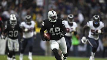 Nov 21, 2016; Mexico City, MEX; Oakland Raiders fullback Jamize Olawale (49) scores on a 75-yard touchdown reception in the fourth quarter against the Houston Texans during a NFL International Series game at Estadio Azteca. The Raiders defeated the Texans 27-20. Mandatory Credit: Kirby Lee-USA TODAY Sports