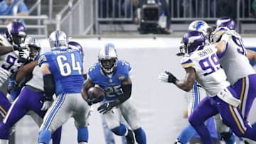 Nov 24, 2016; Detroit, MI, USA; Detroit Lions running back Theo Riddick (25) runs the ball toward Minnesota Vikings defensive end Danielle Hunter (99) during the fourth quarter at Ford Field. Lions win 16-13. Mandatory Credit: Raj Mehta-USA TODAY Sports