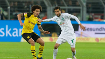DORTMUND, GERMANY - DECEMBER 15: Axel Witsel of Dortmund and Nuri Sahin of Werder Bremen battle for the ball during the Bundesliga match between Borussia Dortmund and SV Werder Bremen at the Signal Iduna Park on December 15, 2018 in Dortmund, Germany. (Photo by TF-Images/TF-Images via Getty Images)