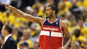 May 5, 2014; Indianapolis, IN, USA; Washington Wizards forward Trevor Ariza (1) points after scoring against the Indiana Pacers in game one of the second round of the 2014 NBA Playoffs at Bankers Life Fieldhouse. Washington defeats Indiana 102-96. Mandatory Credit: Brian Spurlock-USA TODAY Sports