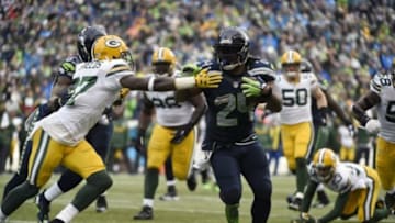 January 18, 2015; Seattle, WA, USA; Seattle Seahawks running back Marshawn Lynch (24) runs the ball against Green Bay Packers cornerback Sam Shields (37) during the second half in the NFC Championship game at CenturyLink Field. Mandatory Credit: Kyle Terada-USA TODAY Sports