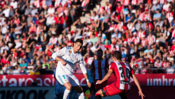 GIRONA, SPAIN - OCTOBER 29: Cristiano Ronaldo of Real Madrid CF dribbles Marc Muniesa of Girona FC during the La Liga match between Girona and Real Madrid at Estadi de Montilivi on October 29, 2017 in Girona, Spain. (Photo by Alex Caparros/Getty Images)