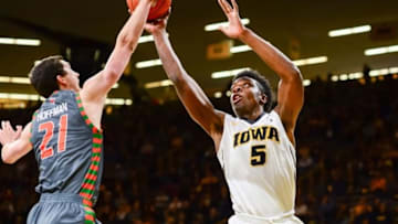 Nov 20, 2016; Iowa City, IA, USA; Texas-Pan American Broncs forward Mike Hoffman (21) blocks the shot of Iowa Hawkeyes forward Tyler Cook (5) during the first half at Carver-Hawkeye Arena. The Hawkeyes won 95-67. Mandatory Credit: Jeffrey Becker-USA TODAY Sports