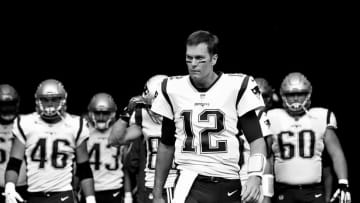 EAST RUTHERFORD, NJ - OCTOBER 15: (Note To Editor: This digital Image has been converted to Black and White)Tom Brady #12 of the New England Patriots leads his team onto the field against the New York Jets before their game at MetLife Stadium on October 15, 2017 in East Rutherford, New Jersey. (Photo by Al Bello/Getty Images)