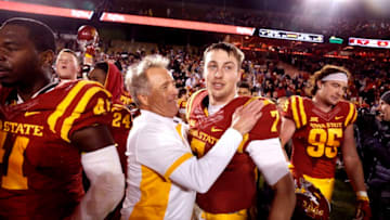 AMES, IA â OCTOBER 31: Defensive ends coach Stan Eggen of the Iowa State Cyclones celebrates with quarterback Joel Lanning #7 of the Iowa State Cyclones after Iowa State defeated Texas Longhorns 24-0 at Jack Trice Stadium on October 31, 2015 in Ames, Iowa. Iowa State defeated Texas 24-0. (Photo by David Purdy/Getty Images)