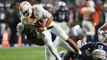 Auburn defensive tackle DaQuan Newkirk (44) takes Tennessee quarterback Jarrett Guarantano (2) down with him as Auburn defensive lineman Colby Wooden (25) grabs at Guarantano's ankle at Jordan-Hare Stadium in Auburn, Ala., on Saturday, Nov. 21, 2020.Auburn Ut
