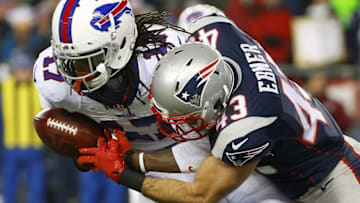 Nov 23, 2015; Foxborough, MA, USA; Buffalo Bills kick returner Denarius Moore (17) hangs onto the ball after being hit by New England Patriots defensive back Nate Ebner (43) during the first half at Gillette Stadium. Mandatory Credit: Winslow Townson-USA TODAY Sports