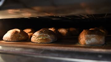 LONDON, ENGLAND - APRIL 14: Bread is seen baking in an oven at The Bread Factory on April 14, 2020 in London, England. During the COVID-19 outbreak and lockdown, the bakery-and-cafe chain says it is providing 2400 meals per week to hospitals in neighborhoods near some of its 50 London stores. It also continues to operate a home delivery business and allows takeaway orders at some locations. (Photo by Peter Summers/Getty Images)