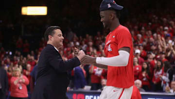 TUCSON, AZ - MARCH 03: Head coach Sean Miller of the Arizona Wildcats greets Deandre Ayton