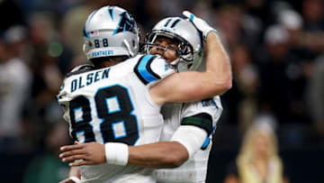 NEW ORLEANS, LA - JANUARY 07: Greg Olsen #88 of the Carolina Panthers celebrates with Cam Newton #1 of the Carolina Panthers after scoring a touchdown during the second half of the NFC Wild Card playoff game against the New Orleans Saints at the Mercedes-Benz Superdome on January 7, 2018 in New Orleans, Louisiana. (Photo by Sean Gardner/Getty Images)
