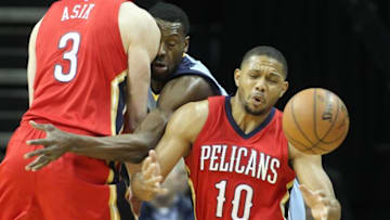 Jan 18, 2016; Memphis, TN, USA; New Orleans Pelicans guard Eric Gordon (10) loses control of the ball as center Omer Asik (3) blocks Memphis Grizzlies guard Tony allen (9) at FedExForum. Memphis defeated New Orleans 101-99. Mandatory Credit: Nelson Chenault-USA TODAY Sports