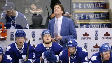 Mar 5, 2016; Toronto, Ontario, CAN; Toronto Maple Leafs head coach Mike Babcock and center William Nylander (39) look on from the bench against the Ottawa Senators at Air Canada Centre. The Senators beat the Maple Leafs 3-2. Mandatory Credit: Tom Szczerbowski-USA TODAY Sports