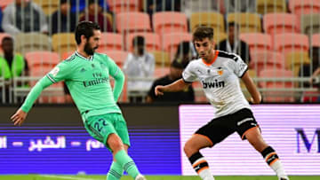 Real Madrid's Spanish midfielder Isco (L) is marked by Valencia's Spanish midfielder Ferran Torres (R) during the Spanish Super Cup semi final between Valencia and Real Madrid on January 8, 2020, at the King Abdullah Sport City in the Saudi Arabian port city of Jeddah. (Photo by GIUSEPPE CACACE / AFP) (Photo by GIUSEPPE CACACE/AFP via Getty Images)