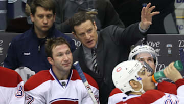Jan 21, 2012; Toronto, ON, Canada; Montreal Canadiens head coach Randy Cunneyworth talks to right wing Erik Cole (72) during their game against the Toronto Maple Leafs at the Air Canada Centre. Mandatory Credit: Tom Szczerbowski-USA TODAY Sports