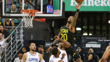 HONOLULU, HAWAII - OCTOBER 8: John Collins #20 of the Utah Jazz tips out a rebound during the first half of the preseason game against the Los Angeles Clippers at SimpliFi Arena at the Stan Sheriff Center on October 8, 2023 in Honolulu, Hawaii. NOTE TO USER: User expressly acknowledges and agrees that, by downloading and or using this photograph, User is consenting to the terms and conditions of the Getty Images License Agreement. (Photo by Darryl Oumi/Getty Images)
