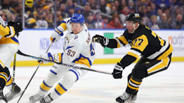Dec 9, 2022; Buffalo, New York, USA; Buffalo Sabres left wing Jeff Skinner (53) skates up ice with the puck as Pittsburgh Penguins center Jeff Carter (77) defends during the second period at KeyBank Center. Mandatory Credit: Timothy T. Ludwig-USA TODAY Sports