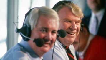 UNSPECIFIED - CIRCA 1986: CBS NFL commentator Pat Summerall (L) and NFL analyst John Madden (R) on the air prior during an NFL Football game circa 1986. (Photo by Focus on Sport/Getty Images)