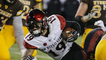 Dec 3, 2016; Laramie, WY, USA; San Diego State Aztecs running back Donnel Pumphrey (19) runs against the Wyoming Cowboys during the fourth quarter at the Mountain West Championship college football game at War Memorial Stadium. The Aztecs beat the Cowboys 27-24. Mandatory Credit: Troy Babbitt-USA TODAY Sports