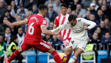MADRID, SPAIN - FEBRUARY 17: Dani Ceballos (R) of Real Madrid in action against Alex Granell (L) of Girona during the La Liga week 24 football match between Real Madrid and Girona at Santiago Bernabeu Stadium in Madrid, Spain on February 17, 2019. (Photo by Burak Akbulut/Anadolu Agency/Getty Images)