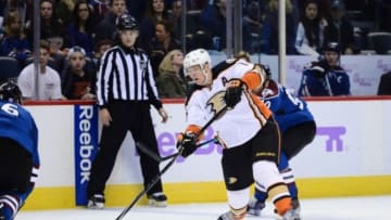 Nov 2, 2014; Denver, CO, USA; Anaheim Ducks right wing Corey Perry (10) attempts a shot on net late in the third period against the Colorado Avalanche at Pepsi Center. The Ducks defeated the Avalanche 3-2. Mandatory Credit: Ron Chenoy-USA TODAY Sports