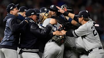 MINNEAPOLIS, MINNESOTA - OCTOBER 07: Aroldis Chapman #54 and the New York Yankees celebrate after the final out defeating the Minnesota Twins 5-1 in game three of the American League Division Series to advance to the American League Championship Series at Target Field on October 07, 2019 in Minneapolis, Minnesota. (Photo by Hannah Foslien/Getty Images)