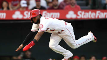 ANAHEIM, CALIFORNIA - AUGUST 31: Luis Rengifo #4 scores on an RBI single hit by Mike Trout #27 of the Los Angeles Angels of Anaheim during the second inning of a game against the Boston Red Sox at Angel Stadium of Anaheim on August 31, 2019 in Anaheim, California. (Photo by Sean M. Haffey/Getty Images)